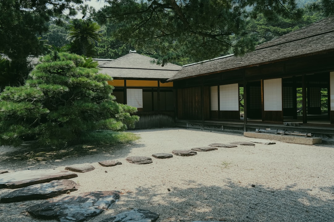 Traditional japanese garden with stone path and building