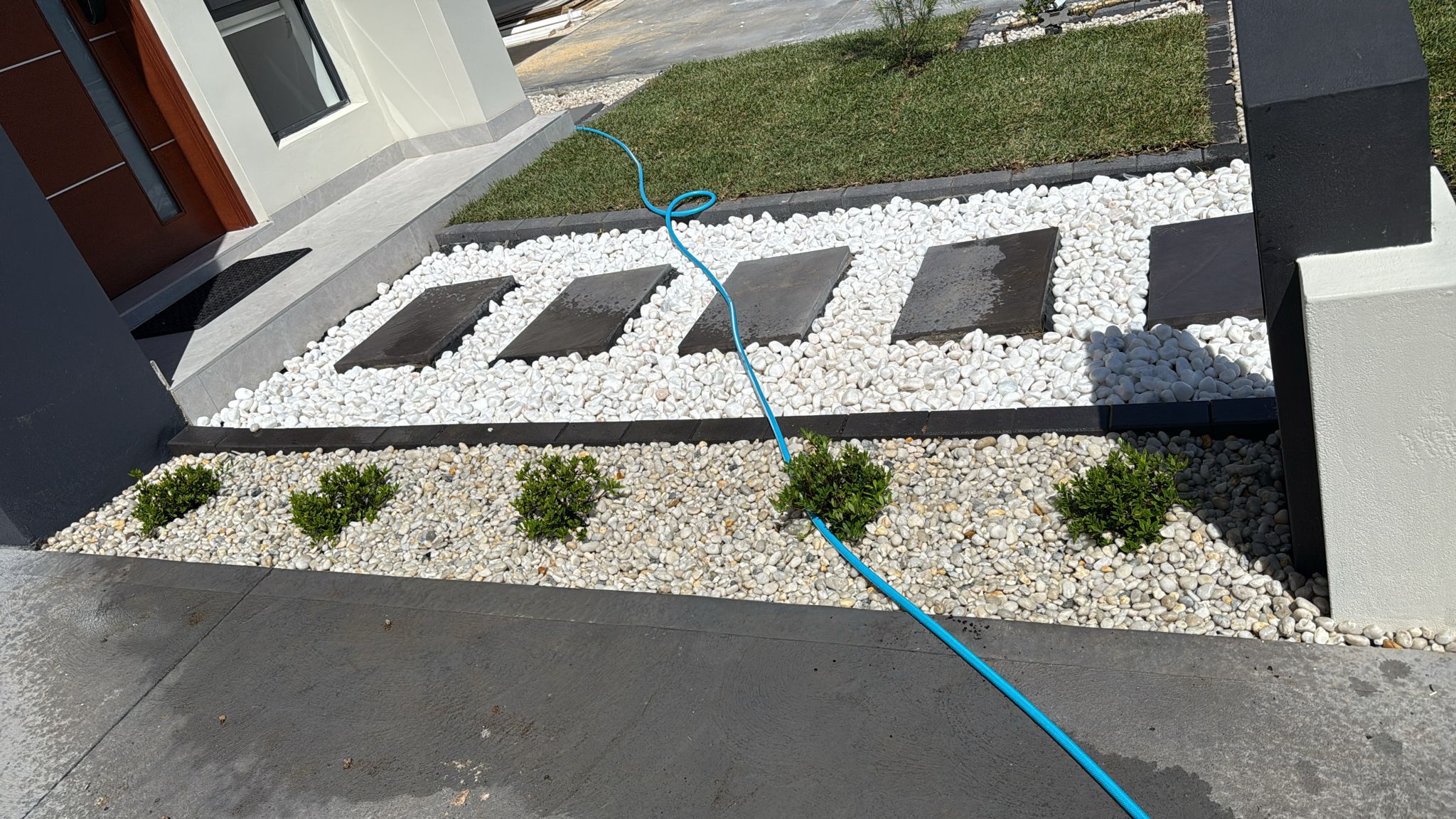 Front pathway with decorative pebbles